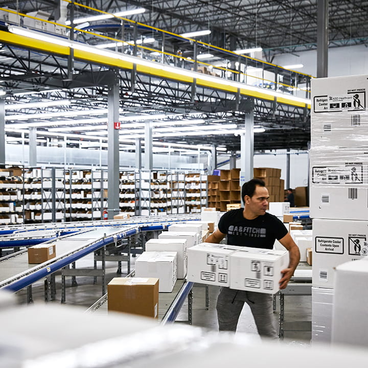 Man moving packages at our distribution center