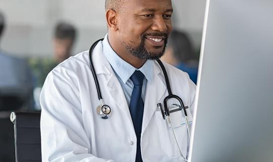 doctor at computer